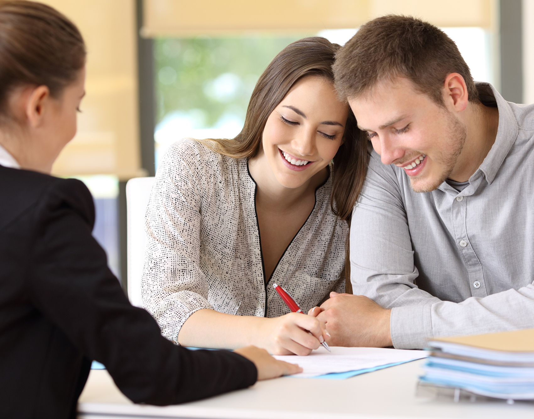 Happy couple reviewing documents together
