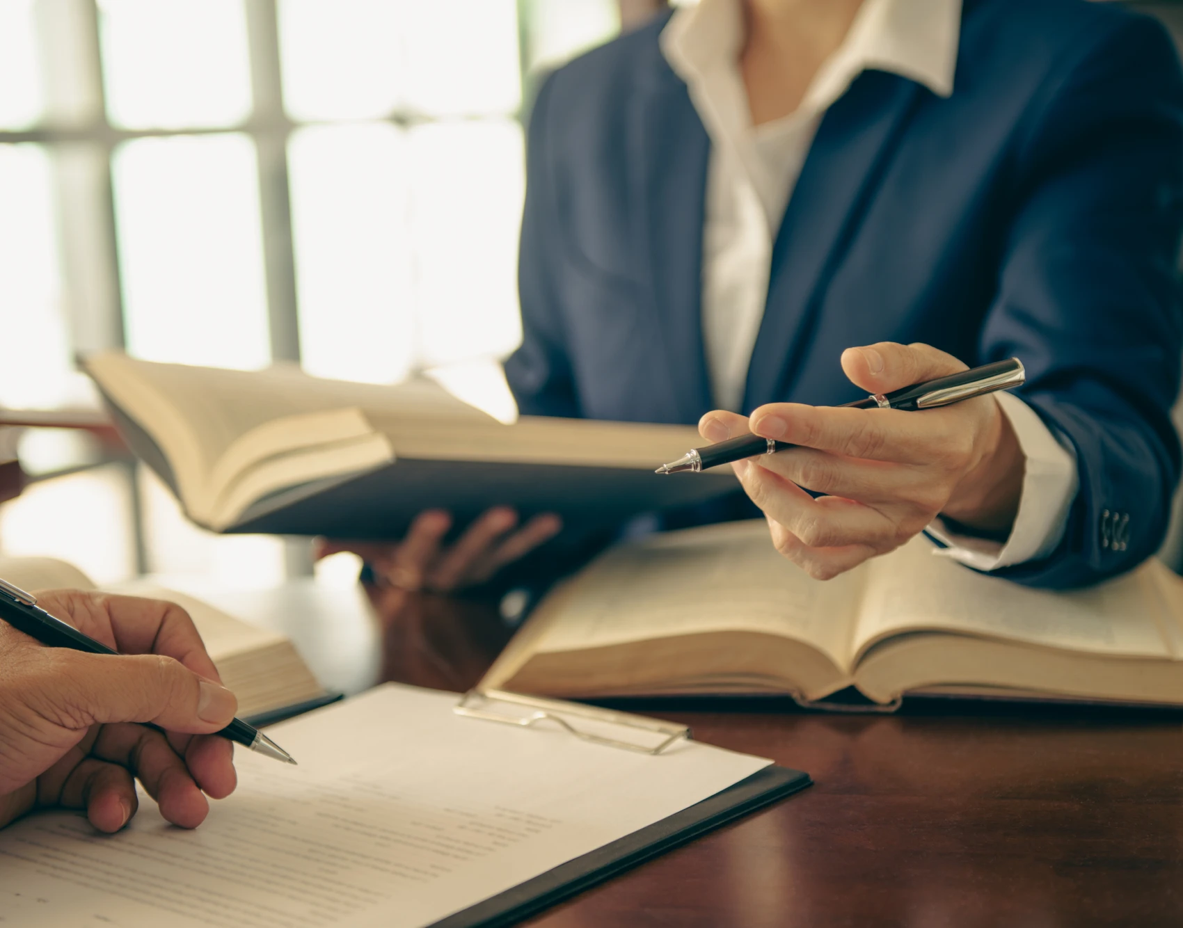Professionals reviewing paperwork together