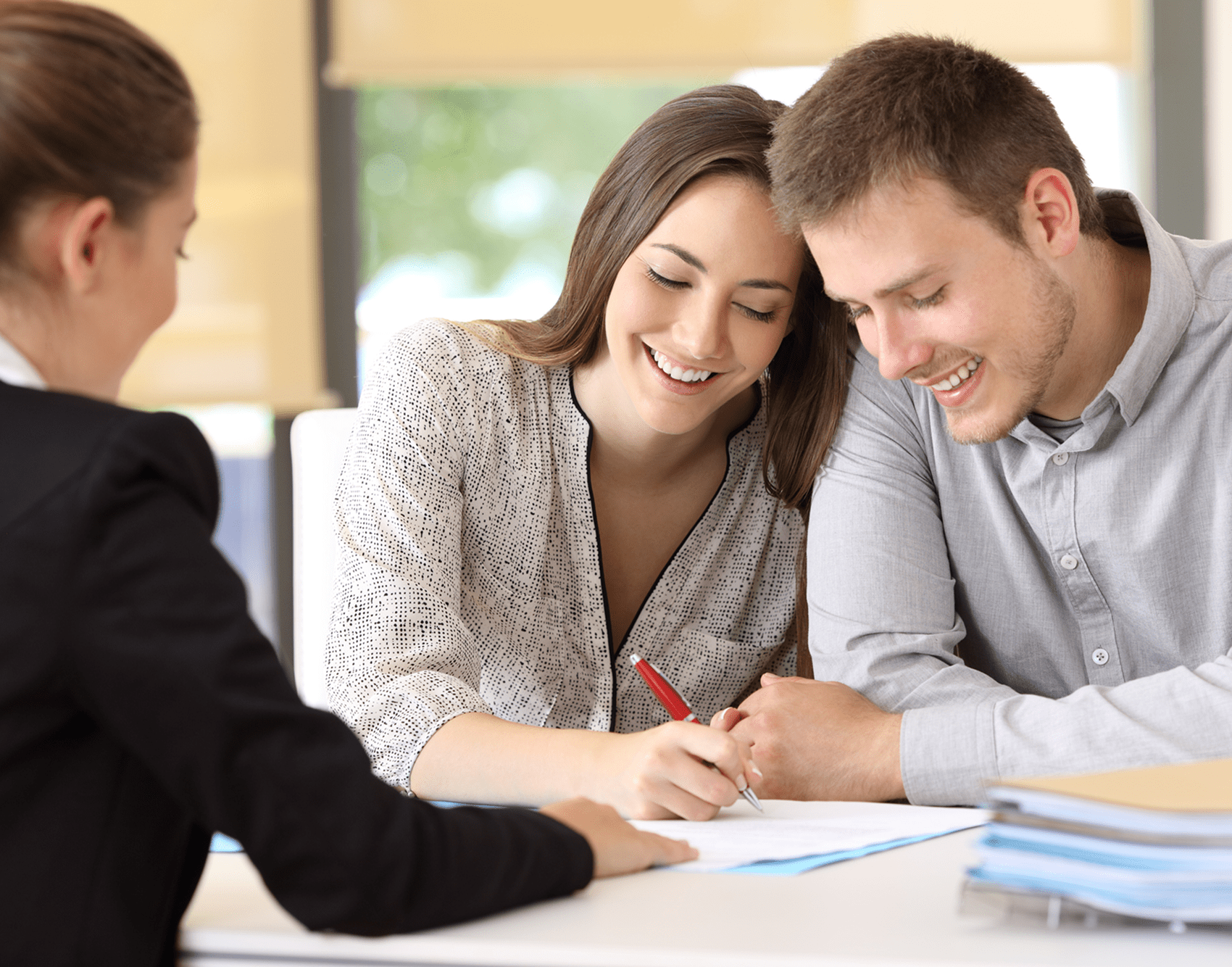 Happy couple reviewing documents together